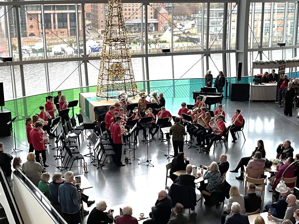 Redhills youth brass band perform in the foyer at sage gateshead